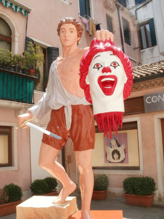Illustration for article titled Italian artist transforms Ronald McDonald into the decapitated head of Medusa